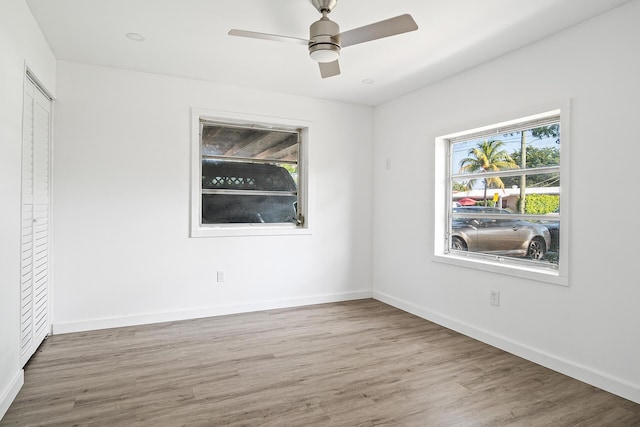 604 W Ocean Ave, Lantana, FL 33462 - unfurnished bedroom with wood finished floors, baseboards, and ceiling fan