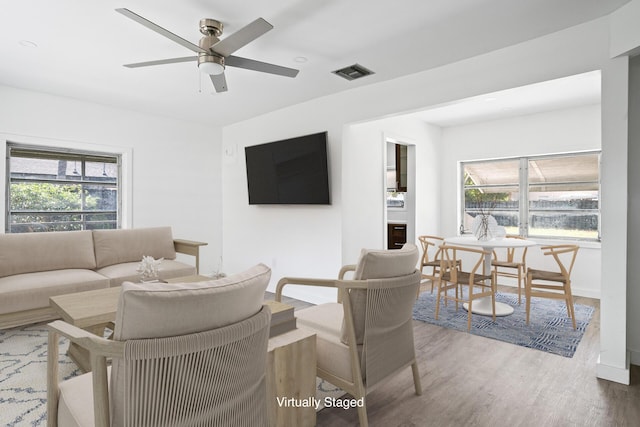 604 W Ocean Ave, Lantana, FL 33462 - living area with wood finished floors, a ceiling fan, and baseboards