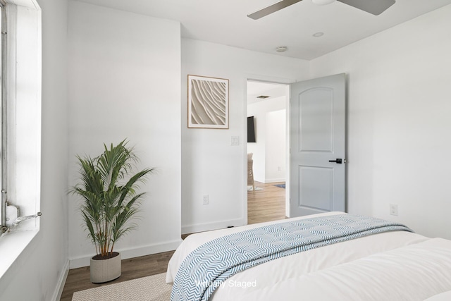 604 W Ocean Ave, Lantana, FL 33462 - bedroom featuring wood finished floors, baseboards, and a ceiling fan
