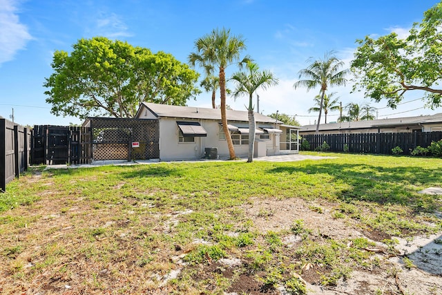 604 W Ocean Ave, Lantana, FL 33462 - view of yard featuring central AC and a patio