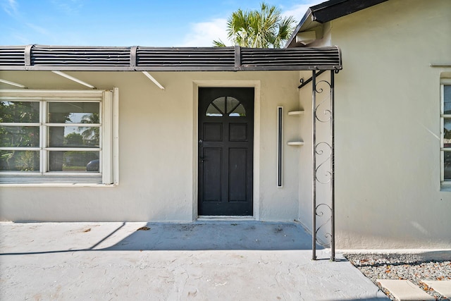 604 W Ocean Ave, Lantana, FL 33462 - entrance to property featuring stucco siding