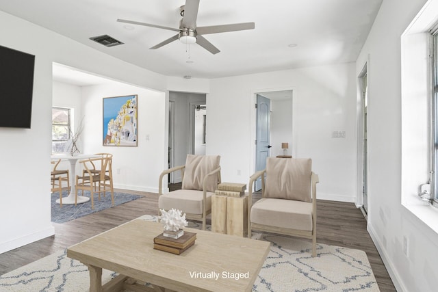604 W Ocean Ave, Lantana, FL 33462 - living area with a ceiling fan, baseboards, and wood finished floors