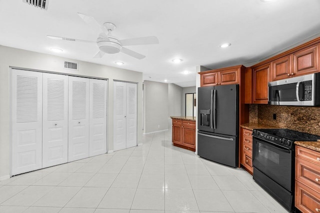 10535 Ladypalm Ln Unit B, Boca Raton, FL 33498 - kitchen with black appliances, ceiling fan, dark stone countertops, backsplash, and recessed lighting