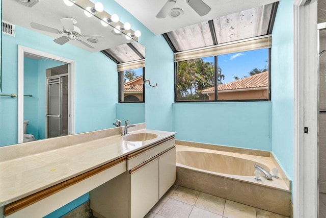 10535 Ladypalm Ln Unit B, Boca Raton, FL 33498 - full bath with a ceiling fan, toilet, a shower stall, vanity, and a garden tub