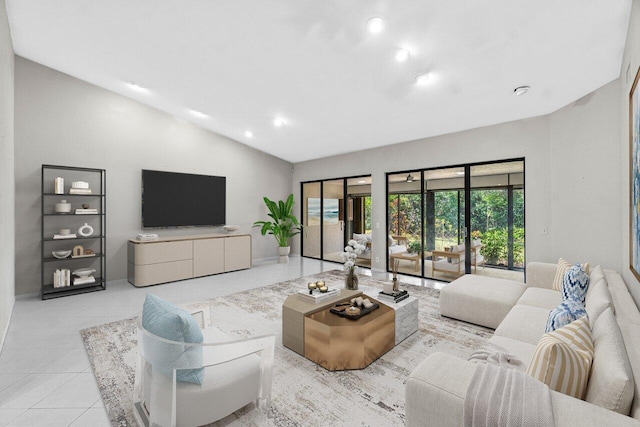 10535 Ladypalm Ln Unit B, Boca Raton, FL 33498 - tiled living room with vaulted ceiling, recessed lighting, and baseboards