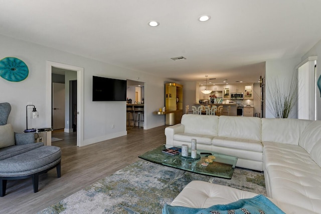 21188 Juego Cir Unit 17-A, Boca Raton, FL 33433 - living room with baseboards, light wood-type flooring, and recessed lighting