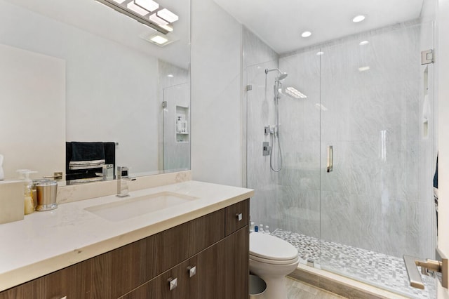 21188 Juego Cir Unit 17-A, Boca Raton, FL 33433 - bathroom featuring toilet, a shower stall, vanity, and recessed lighting