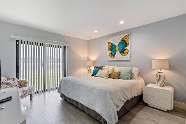 21188 Juego Cir Unit 17-A, Boca Raton, FL 33433 - bedroom featuring wood finished floors, recessed lighting, access to outside, and baseboards