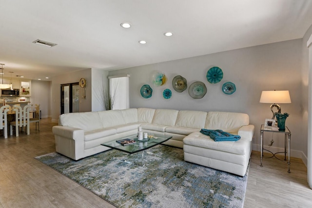21188 Juego Cir Unit 17-A, Boca Raton, FL 33433 - living area featuring baseboards, recessed lighting, and light wood-type flooring