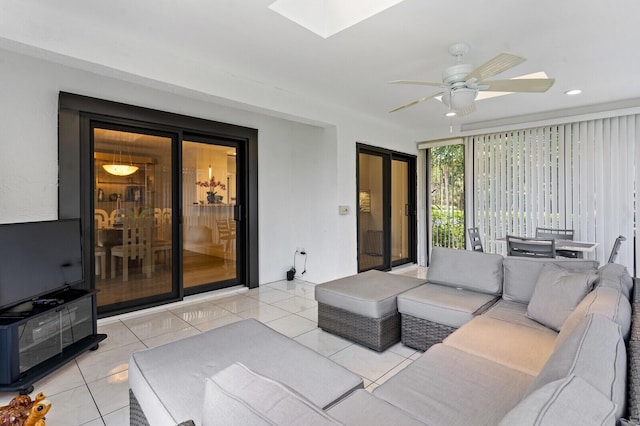 21188 Juego Cir Unit 17-A, Boca Raton, FL 33433 - living room featuring ceiling fan, light tile patterned floors, a skylight, and recessed lighting