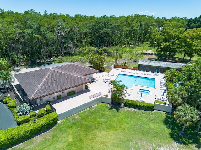 21188 Juego Cir Unit 17-A, Boca Raton, FL 33433 - aerial view of property and surrounding area featuring a pool and a heavily wooded area