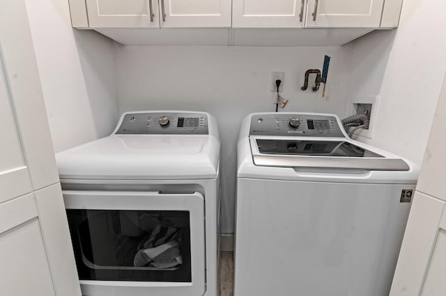 21188 Juego Cir Unit 17-A, Boca Raton, FL 33433 - laundry area featuring washing machine and dryer and cabinet space
