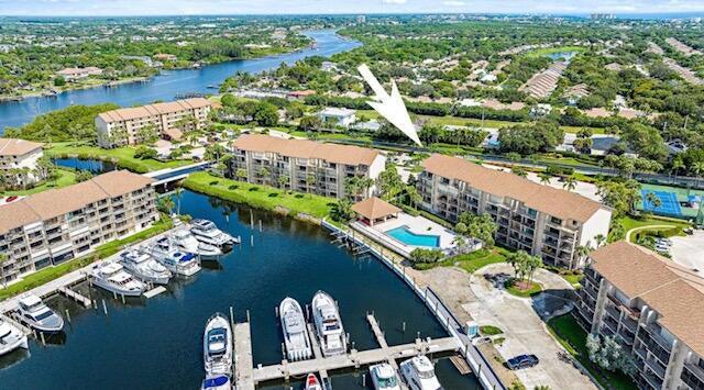 bird's eye view of a nearby body of water and apartment complex