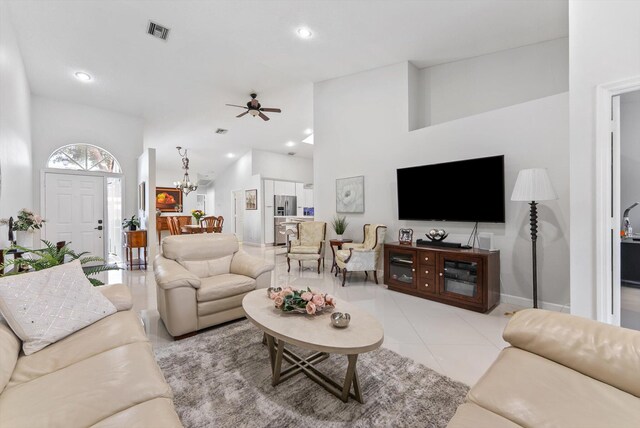 8237 Via Di Veneto, Boca Raton, FL 33496 - living room with a ceiling fan, a chandelier, recessed lighting, light tile patterned floors, and baseboards