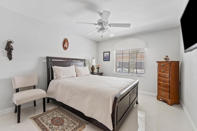 8237 Via Di Veneto, Boca Raton, FL 33496 - bedroom with light tile patterned floors, baseboards, a ceiling fan, and a textured ceiling