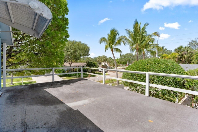 view of patio featuring a balcony