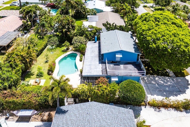 aerial view of property and surrounding area with a pool