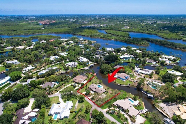 aerial perspective of suburban area with a large body of water