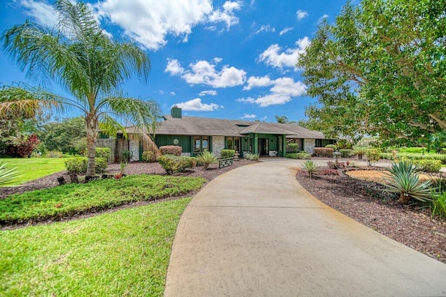 ranch-style home with a front yard