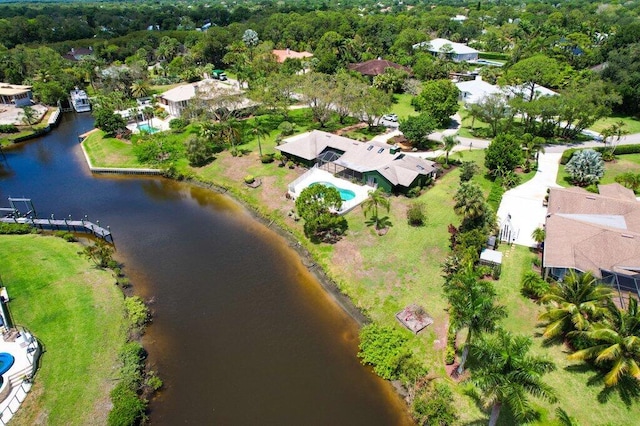 view of property location with a large body of water and nearby suburban area