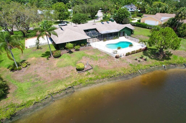 view from above of property with a pool area and a nearby body of water