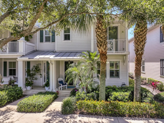 1330 S Jeaga Dr, Jupiter, FL 33458 - multi unit property with a porch, a standing seam roof, a balcony, and metal roof
