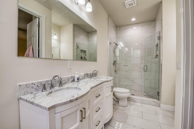 1330 S Jeaga Dr, Jupiter, FL 33458 - full bathroom featuring marble look tiles, toilet, double vanity, a stall shower, and baseboards