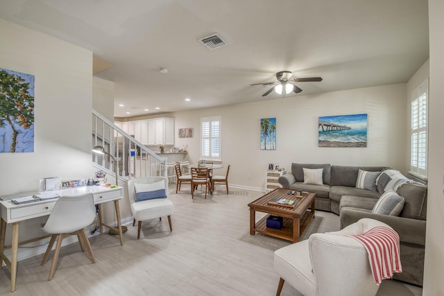1330 S Jeaga Dr, Jupiter, FL 33458 - living room featuring baseboards, light wood-type flooring, stairway, a ceiling fan, and recessed lighting