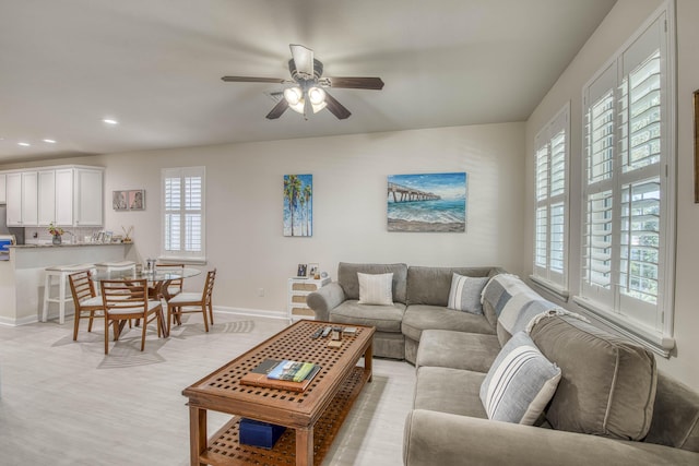 1330 S Jeaga Dr, Jupiter, FL 33458 - living area with baseboards, ceiling fan, recessed lighting, and light wood-type flooring