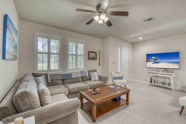 1330 S Jeaga Dr, Jupiter, FL 33458 - living room with baseboards, ceiling fan, and light wood-style flooring