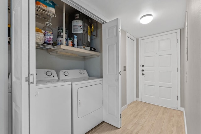 184 NW 115th Ter, Plantation, FL 33325 - laundry room with independent washer and dryer, light wood-style flooring, and baseboards