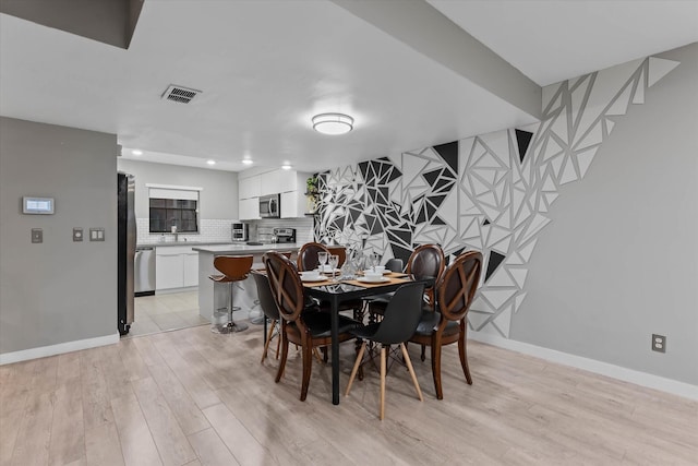 184 NW 115th Ter, Plantation, FL 33325 - dining room with light wood finished floors, baseboards, and recessed lighting