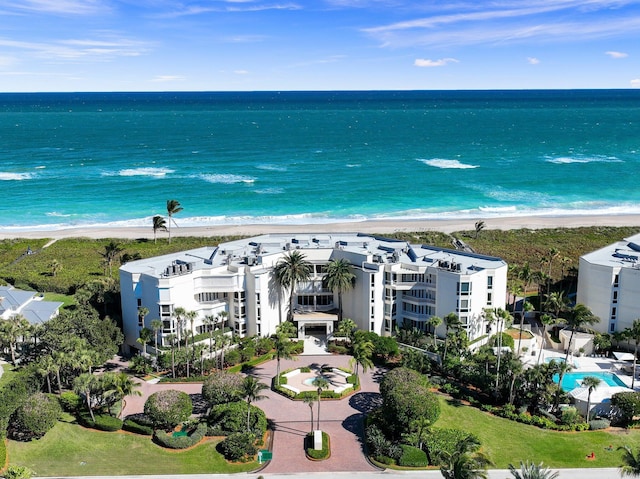bird's eye view of expansive beach and apartment complex