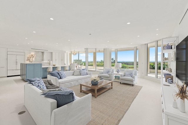 living room featuring expansive windows and recessed lighting