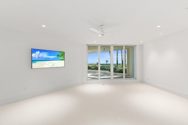 spare room with recessed lighting, a ceiling fan, and baseboards