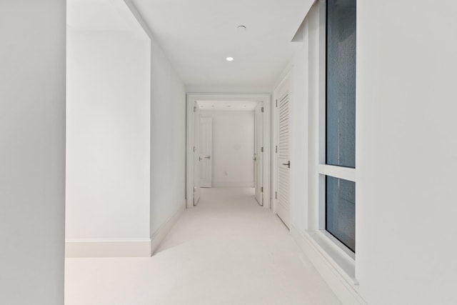 corridor with recessed lighting and carpet