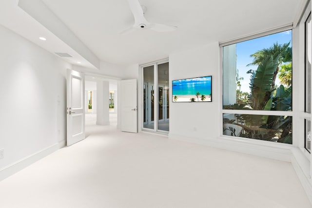 spare room featuring ceiling fan, recessed lighting, carpet, and baseboards
