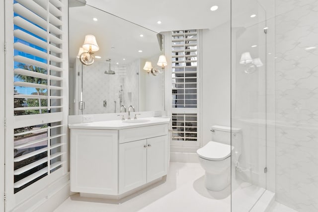 bathroom featuring a marble finish shower, vanity, toilet, and recessed lighting