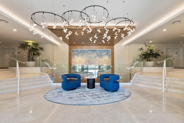 community lobby featuring stairs and recessed lighting