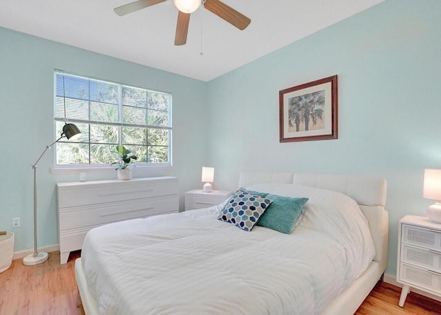 9857 Baywinds Dr Unit 9302, West Palm Beach, FL 33411 - bedroom featuring light wood-style floors, baseboards, and a ceiling fan