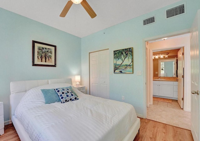 9857 Baywinds Dr Unit 9302, West Palm Beach, FL 33411 - bedroom with light wood-style flooring, a closet, baseboards, and a ceiling fan
