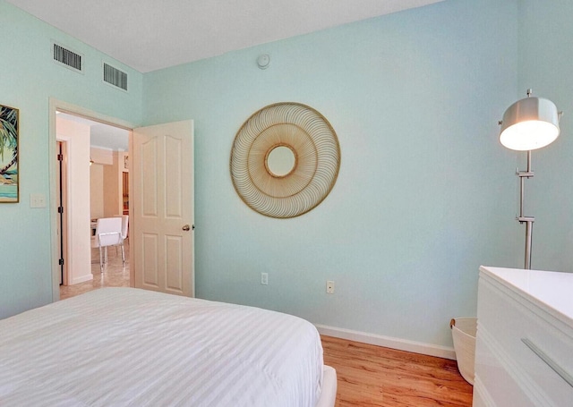 9857 Baywinds Dr Unit 9302, West Palm Beach, FL 33411 - bedroom with light wood finished floors and baseboards