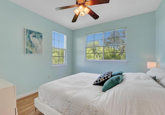 9857 Baywinds Dr Unit 9302, West Palm Beach, FL 33411 - bedroom with wood finished floors, baseboards, and ceiling fan