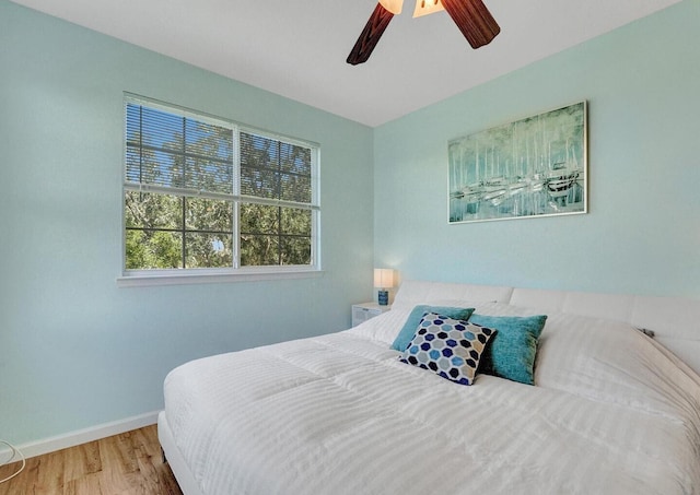 9857 Baywinds Dr Unit 9302, West Palm Beach, FL 33411 - bedroom featuring wood finished floors, baseboards, and ceiling fan
