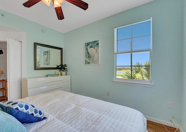 9857 Baywinds Dr Unit 9302, West Palm Beach, FL 33411 - bedroom featuring wood finished floors, baseboards, and ceiling fan