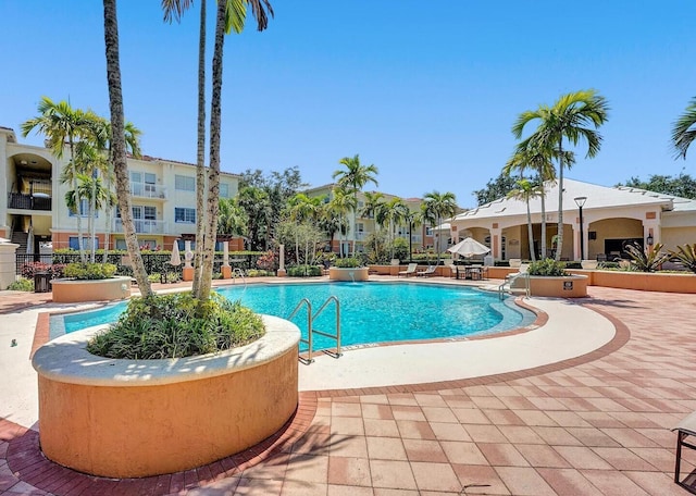 9857 Baywinds Dr Unit 9302, West Palm Beach, FL 33411 - community pool featuring a patio