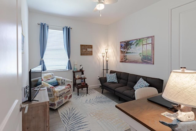 745 SE Bloomfield Rd, Port Saint Lucie, FL 34984 - living area featuring ceiling fan, wood finished floors, and baseboards