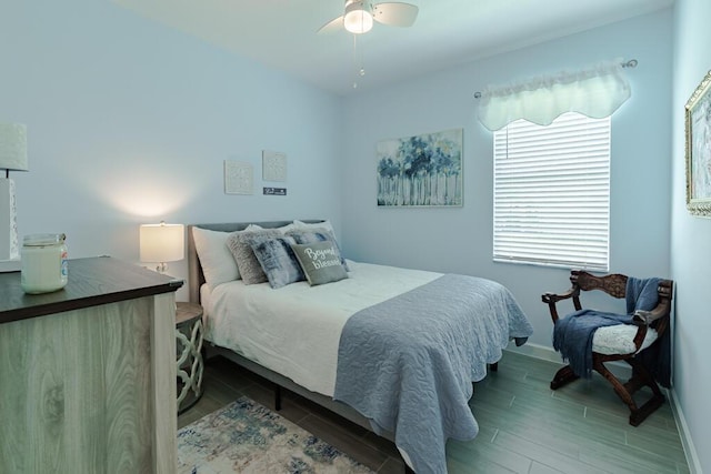 745 SE Bloomfield Rd, Port Saint Lucie, FL 34984 - bedroom featuring wood tiled floors, baseboards, and ceiling fan