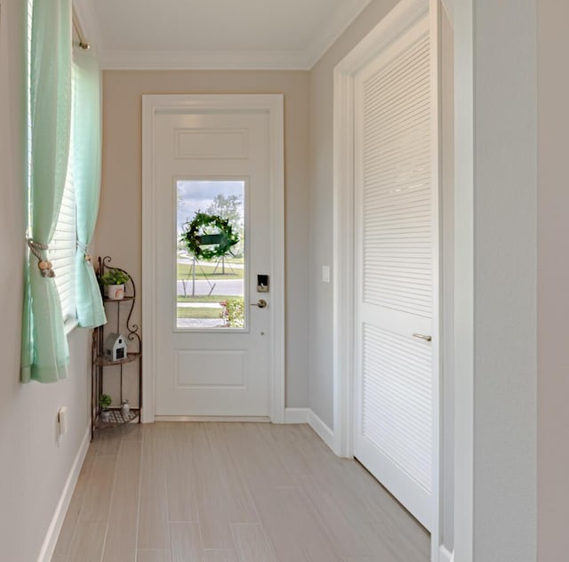 745 SE Bloomfield Rd, Port Saint Lucie, FL 34984 - entryway with baseboards and crown molding