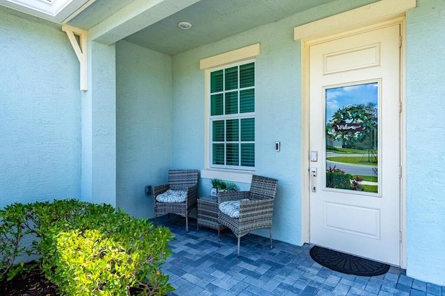 745 SE Bloomfield Rd, Port Saint Lucie, FL 34984 - entrance to property featuring stucco siding and covered porch